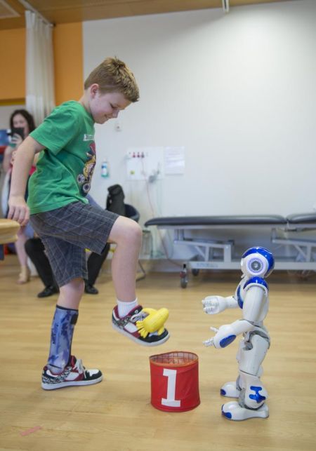Miles performing rehabilitation with the Robot 