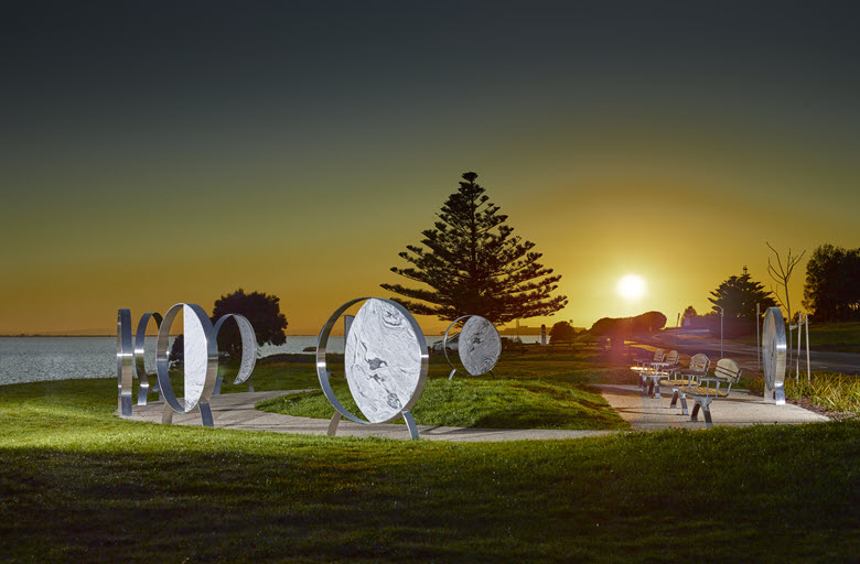 Road trauma memorial at sunset