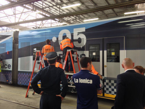 Working on the booze bus tram wrap