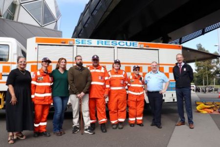 SES representatives standing in front of an SES TAC truck with TAC's Samantha Cockfield