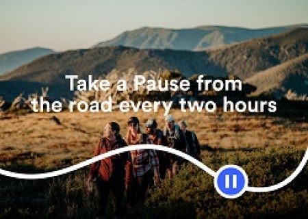 A group of people walking in a dry paddock with hills in the background. Wording is Take a Pause from the road every two hours.