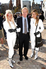 David Heal (TAC Senior Road Safety Manager) and TAC promotional staff in protective clothing at MotoGP event at Federation Square